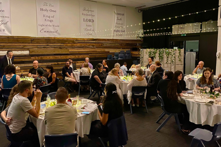 Derech HaMashiach members sharing a meal together