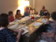 Derech HaMashiach community members together eating a meal